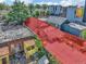 Aerial view of a city block with various buildings and a lot for sale at 3735 N Marion St, Denver, CO 80205