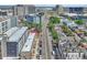 Aerial showing a city street with various sized buildings and parked cars at 3735 N Marion St, Denver, CO 80205