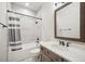 Basement bathroom with tub shower combo and vanity at 7912 Galileo Way, Littleton, CO 80125