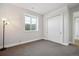 Basement bedroom with double doors and a large window at 7912 Galileo Way, Littleton, CO 80125