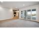 Spacious basement recreation room with access to a patio at 7912 Galileo Way, Littleton, CO 80125