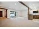 Finished basement with wet bar, and sliding glass doors leading to backyard at 7912 Galileo Way, Littleton, CO 80125