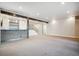 Spacious finished basement featuring a large open area and a wet bar at 7912 Galileo Way, Littleton, CO 80125