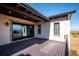 Large deck with sliding glass doors, showcasing beautiful views at 7912 Galileo Way, Littleton, CO 80125