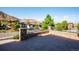 Brick patio with wrought iron fencing, showcasing neighborhood views and landscaping at 7912 Galileo Way, Littleton, CO 80125