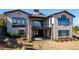 Luxury two-story home with stucco exterior and balcony at 7912 Galileo Way, Littleton, CO 80125