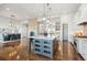 Spacious kitchen with large island, custom cabinetry, and high-end appliances at 7912 Galileo Way, Littleton, CO 80125