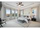 Luxurious main bedroom with ample natural light and sitting area at 7912 Galileo Way, Littleton, CO 80125