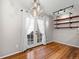 Bright dining room with hardwood floors and French doors leading to a patio at 1245 S Idalia St, Aurora, CO 80017