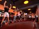 People enjoying a fitness class at an Orangetheory Fitness center at 4215 W Byron Pl, Denver, CO 80212