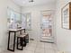 Kitchen nook with a small table, bar stools, and access to the outdoors at 4215 W Byron Pl, Denver, CO 80212