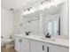 Clean bathroom, featuring double vanity and a large mirror at 1381 Rock Cliff Ave, Erie, CO 80516