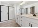 Modern bathroom with double vanity and walk-in shower at 1381 Rock Cliff Ave, Erie, CO 80516