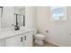 Clean bathroom with white vanity, quartz countertop, and modern fixtures at 1381 Rock Cliff Ave, Erie, CO 80516