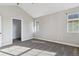 Spacious bedroom with carpet, large window, and an attached closet at 1677 S Buckley Cir, Aurora, CO 80017