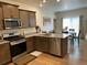 Modern kitchen featuring stainless steel appliances and granite countertops at 1008 Ryland Rd, Brighton, CO 80603