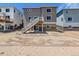 Two-story house with deck and unfinished backyard at 3302 N Highlands Creek Pkwy, Aurora, CO 80019