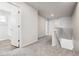 Upstairs hallway with carpet and doors to bedrooms and bathroom at 3302 N Highlands Creek Pkwy, Aurora, CO 80019