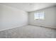 Spacious bedroom with neutral carpeting and a window at 3302 N Highlands Creek Pkwy, Aurora, CO 80019