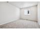 Spacious bedroom with carpet and large window at 3302 N Highlands Creek Pkwy, Aurora, CO 80019