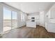 Modern kitchen featuring island, white cabinets, and stainless steel appliances at 3302 N Highlands Creek Pkwy, Aurora, CO 80019
