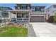 Two-story home with front porch and attached garage at 3302 N Highlands Creek Pkwy, Aurora, CO 80019