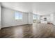 Spacious living room with hardwood floors and access to deck at 3302 N Highlands Creek Pkwy, Aurora, CO 80019