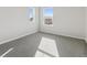 Well-lit bedroom featuring grey carpet and two large windows at 3812 N Elk St, Aurora, CO 80019