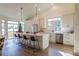 Modern kitchen featuring white cabinets, quartz countertops, and stainless steel appliances at 4 Skye Pl, Highlands Ranch, CO 80130