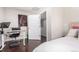 Bright bedroom with built-in workspace and ensuite access at 237 S Old Hammer St, Aurora, CO 80018