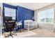 Bedroom with crib, desk and plenty of natural light at 237 S Old Hammer St, Aurora, CO 80018
