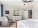 Bright bedroom with large windows and comfortable seating at 237 S Old Hammer St, Aurora, CO 80018