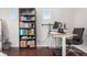 Home office with standing desk, bookcase, and chair at 237 S Old Hammer St, Aurora, CO 80018