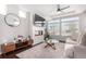 Spacious living room featuring a modern fireplace and large windows at 237 S Old Hammer St, Aurora, CO 80018