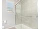 Modern shower with glass enclosure and neutral tile at 237 S Old Hammer St, Aurora, CO 80018