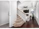 Beige carpeted stairs leading to the upper level at 237 S Old Hammer St, Aurora, CO 80018