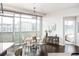 Bright dining area with city view, glass table, and modern chairs at 2001 Lincoln St # 722, Denver, CO 80202