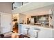 Modern kitchen with stainless steel appliances and a breakfast bar at 10785 W 63Rd Pl # 307, Arvada, CO 80004