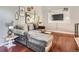 Living room with sectional sofa, hardwood floors, and built-in entertainment center at 10785 W 63Rd Pl # 307, Arvada, CO 80004