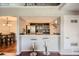 Modern kitchen with stainless steel appliances and a breakfast bar at 10785 W 63Rd Pl # 307, Arvada, CO 80004