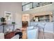 Open living space with a kitchen island, dining area, and loft at 10785 W 63Rd Pl # 307, Arvada, CO 80004