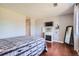 Spacious bedroom with a fireplace and hardwood floors at 10785 W 63Rd Pl # 307, Arvada, CO 80004