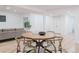 Basement dining area with round wood table and chairs at 4601 S Lipan St, Englewood, CO 80110