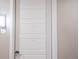 Private apartment entry door with modern handle at 12983 W Ida Ave # 109 Ada Type A, Littleton, CO 80127