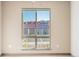 Bedroom with a window overlooking a residential area at 12983 W Ida Ave # 109 Ada Type A, Littleton, CO 80127