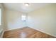 Charming bedroom with hardwood floors and a window at 2100 N Franklin St # 8, Denver, CO 80205