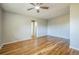 Hardwood floor bedroom with ceiling fan and access to bathroom at 2100 N Franklin St # 8, Denver, CO 80205