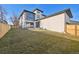 Private backyard with grassy lawn and modern home at 2650 Zenobia, Denver, CO 80212