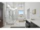 Spa-like bathroom with a large walk-in shower, soaking tub and marble finishes at 2650 Zenobia, Denver, CO 80212
