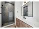 Modern bathroom with herringbone tile shower and quartz countertop at 2650 Zenobia, Denver, CO 80212